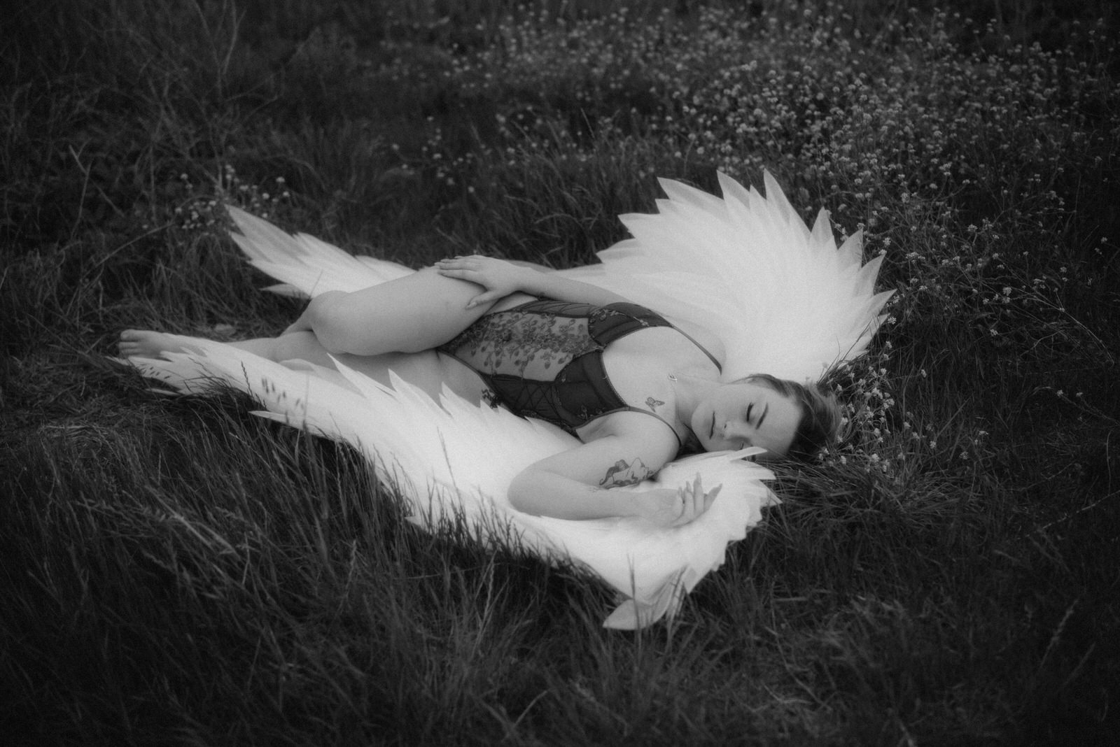 Laying down photoshoot with angel wings