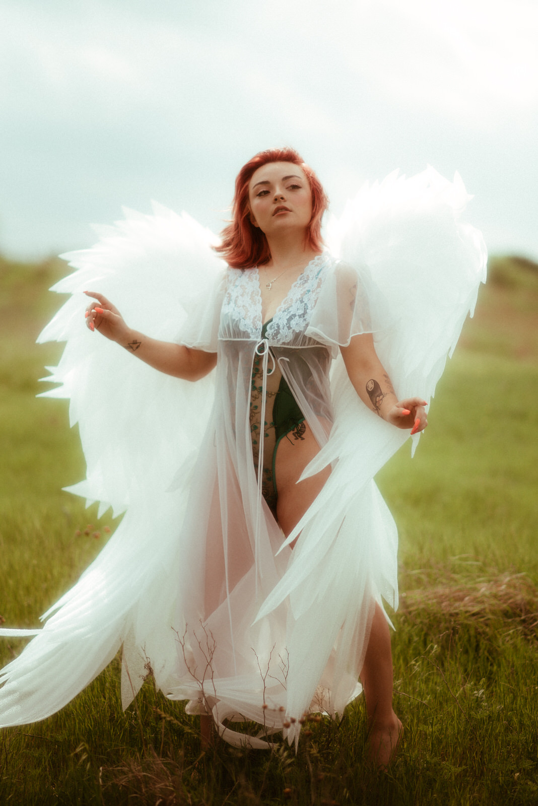 Boudoir photos with large angel wings by Royal Lune Photo in DFW