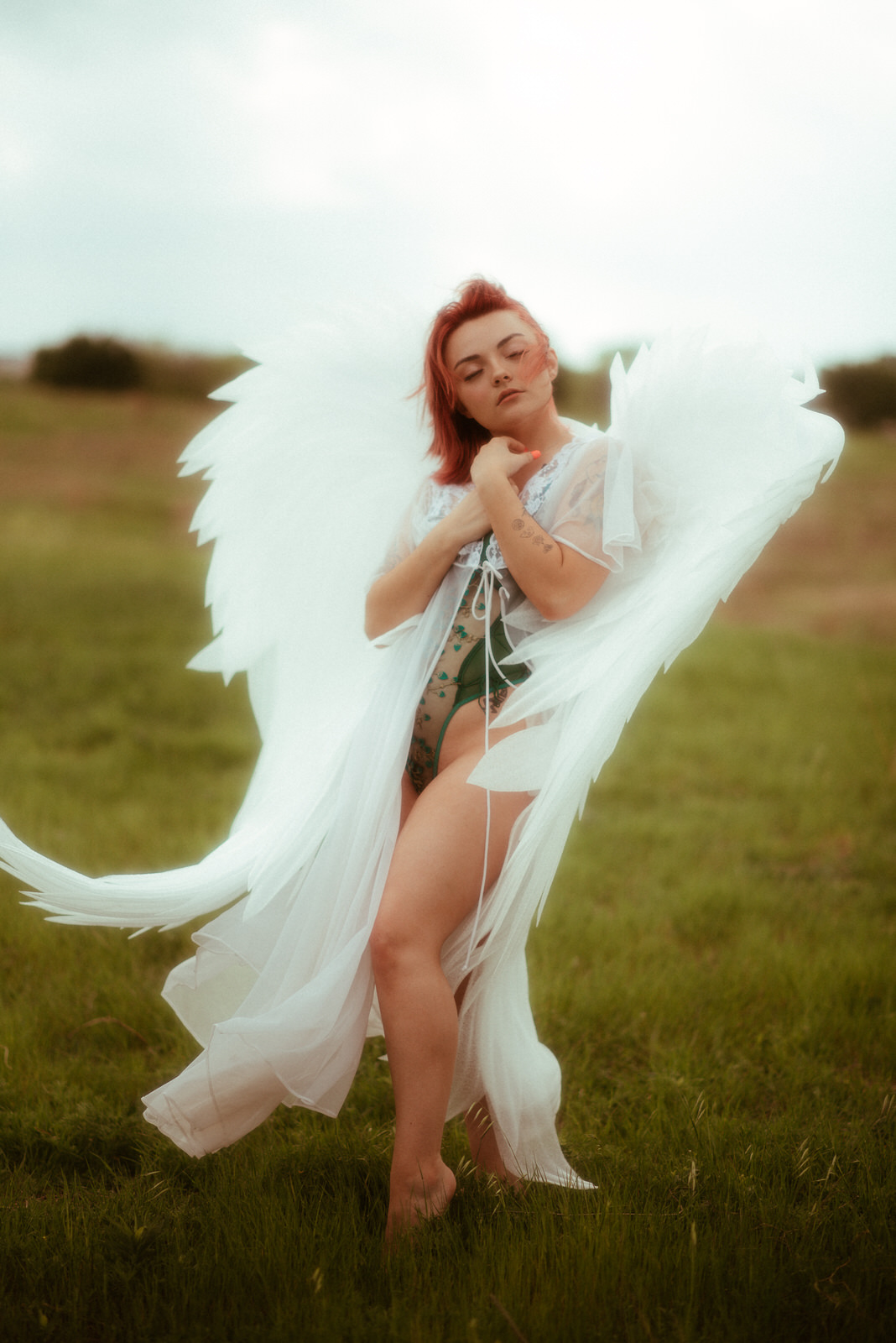 Outdoor photoshoot with large angel wings