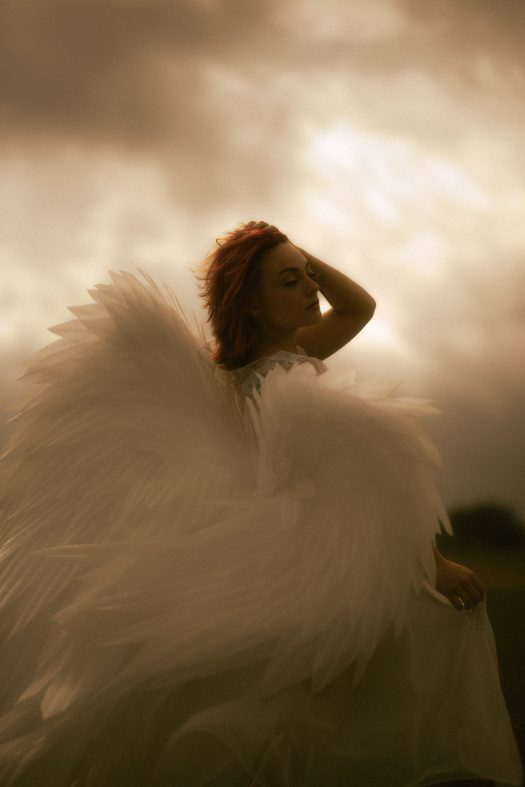 Moody photoshoot with large angel wings in Dallas, TX