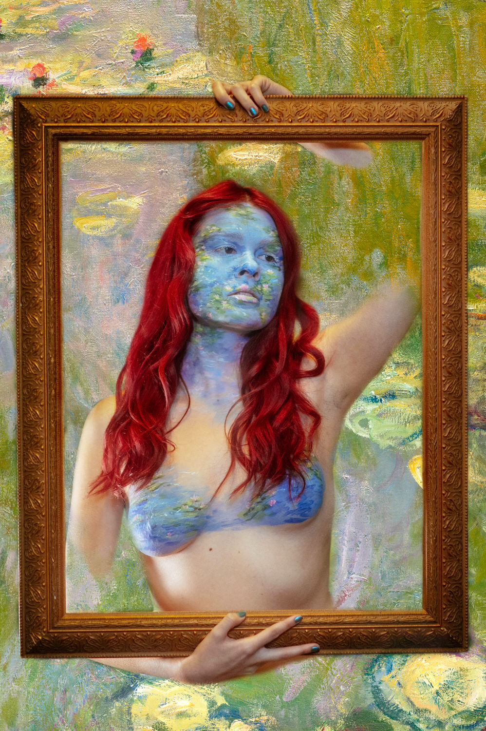 A woman with red hair poses topless, body painted with a Monet-inspired landscape, holding a frame around herself. The background mirrors this impressionistic style, creating an artistic photoshoot vibe.