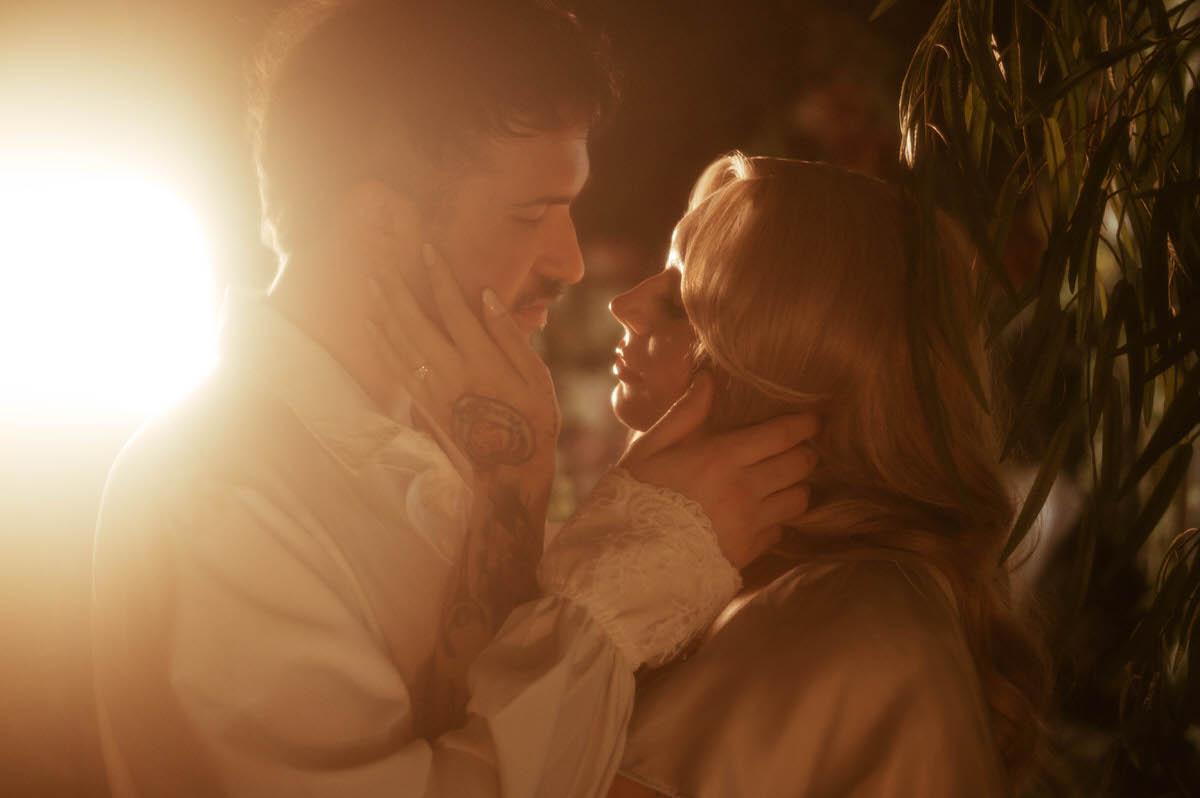 A tender moment between the couple at Royal Lune Studio, their faces inches apart as they hold each other lovingly in golden light. The backlighting and soft focus evoke a timeless, romantic feel in this dreamy engagement photo.