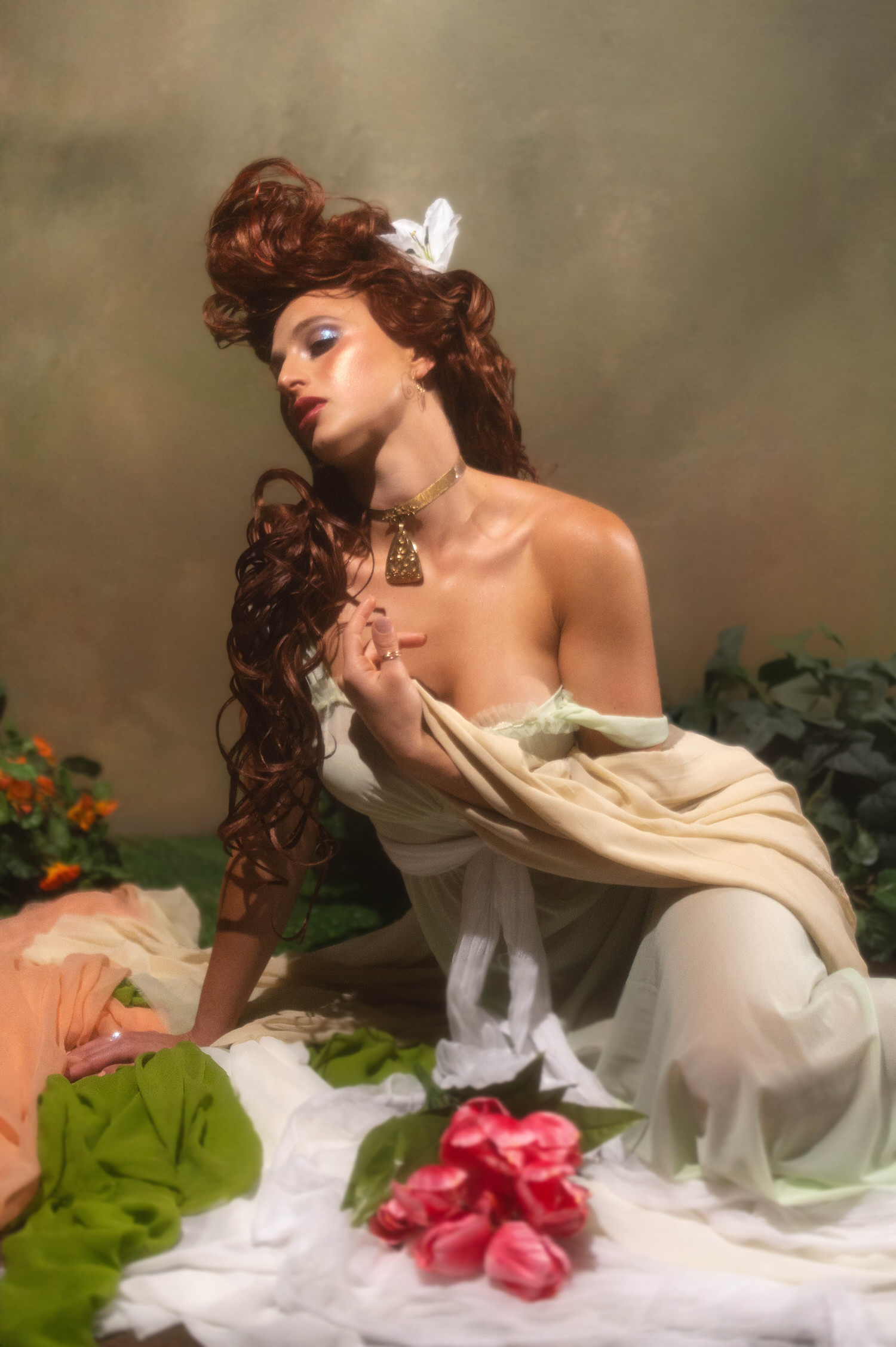 This fine art image captures Art Nouveau inspiration. Shot at Royal Lune Studio near Dallas, the portrait shows a model posing on the floor with vibrant pink tulips.